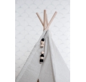 White canvas Indian tepee with small wooden toys